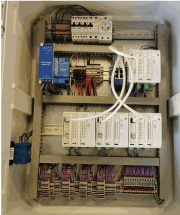 Control cabinet with Industrial Shields PLCs on DIN rails, network cables and terminal blocks