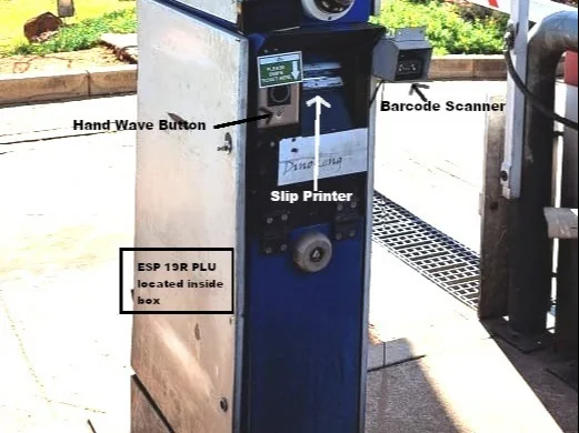 Gate pedestal at Dinokeng with the hand wave button, the barcode scanner and the slip printer, and a note that the ESP32 PLC is inside the box