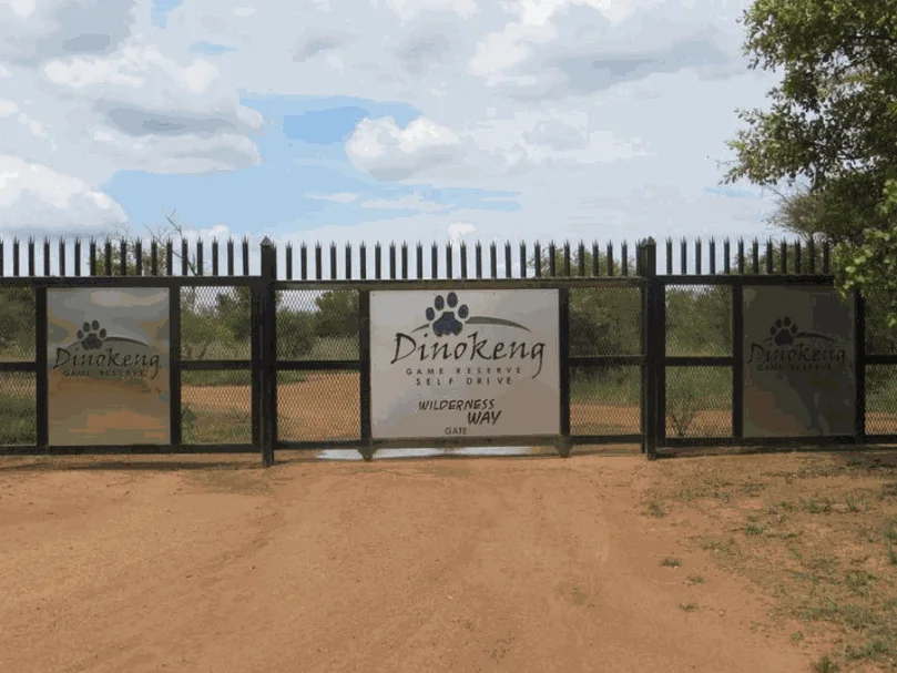 Wilderness Way self drive gate of Dinokeng Game Reserve, with steel gates and reserve signs