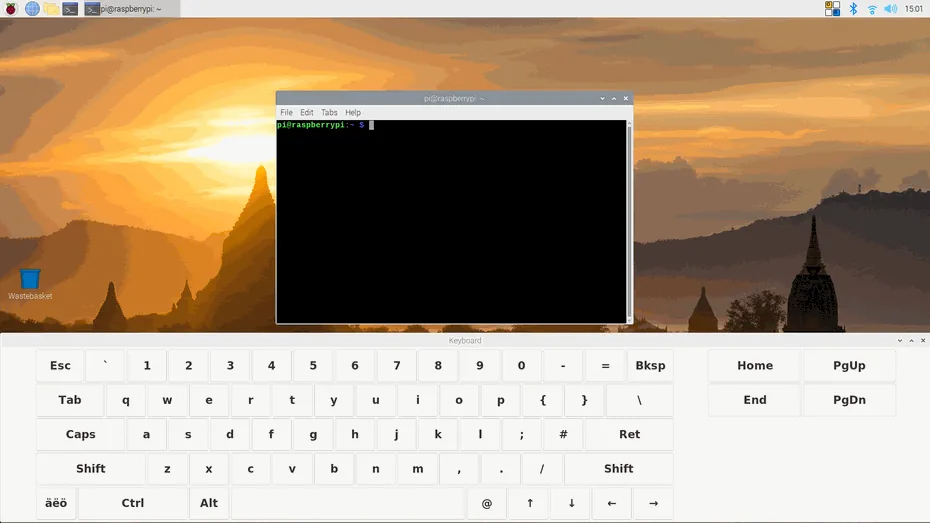 Raspberry Pi OS desktop with a terminal window and the Matchbox keyboard across the bottom of the screen