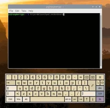 Onboard keyboard open below a terminal window on the Raspberry Pi desktop