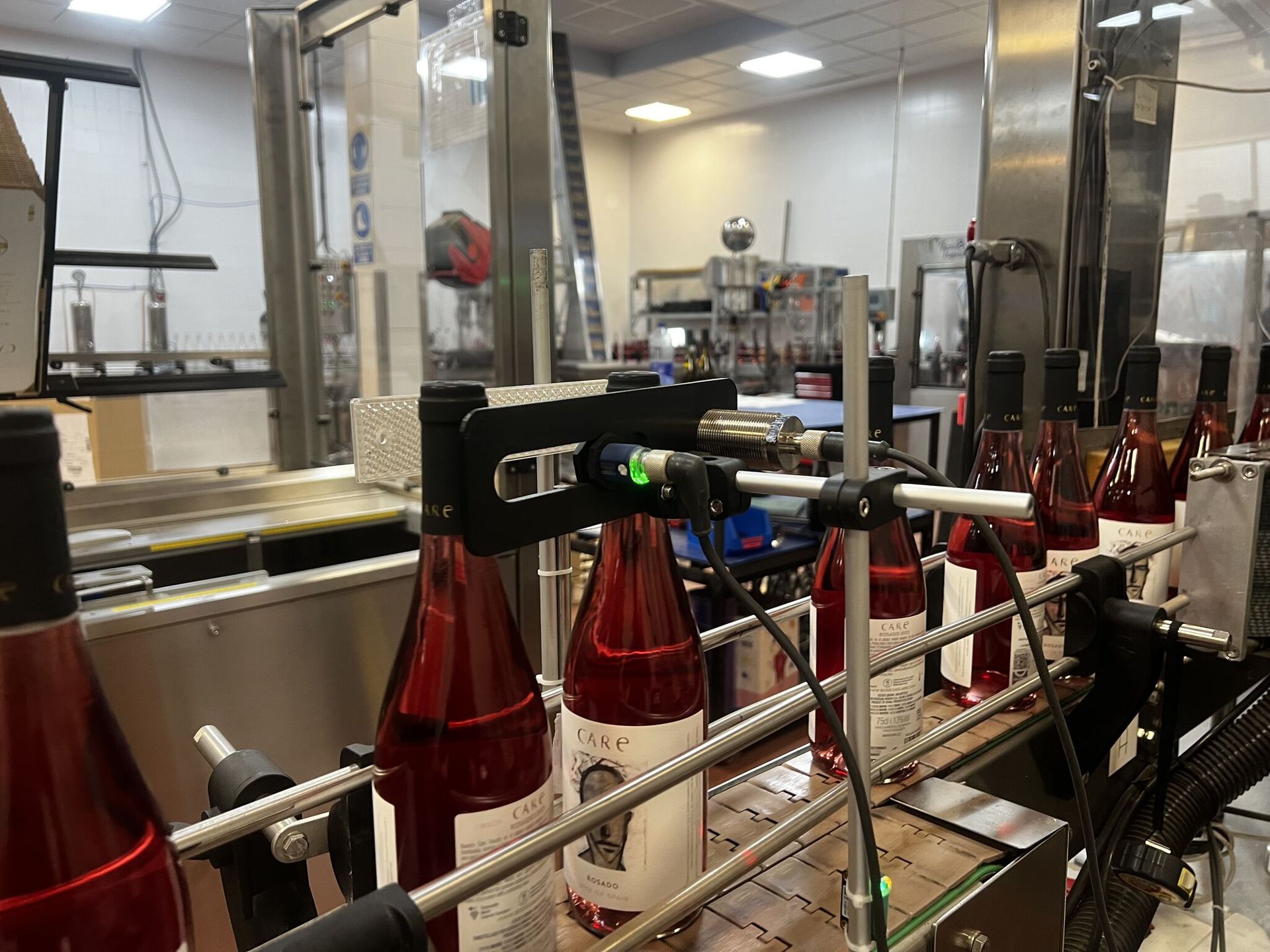 Bodegas Care bottling line with cap detection sensor installed